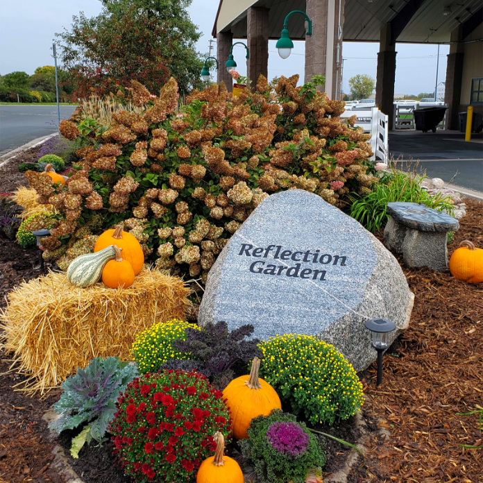 Equine reflection garden has stones and plants and decorations for remembering beloved horses