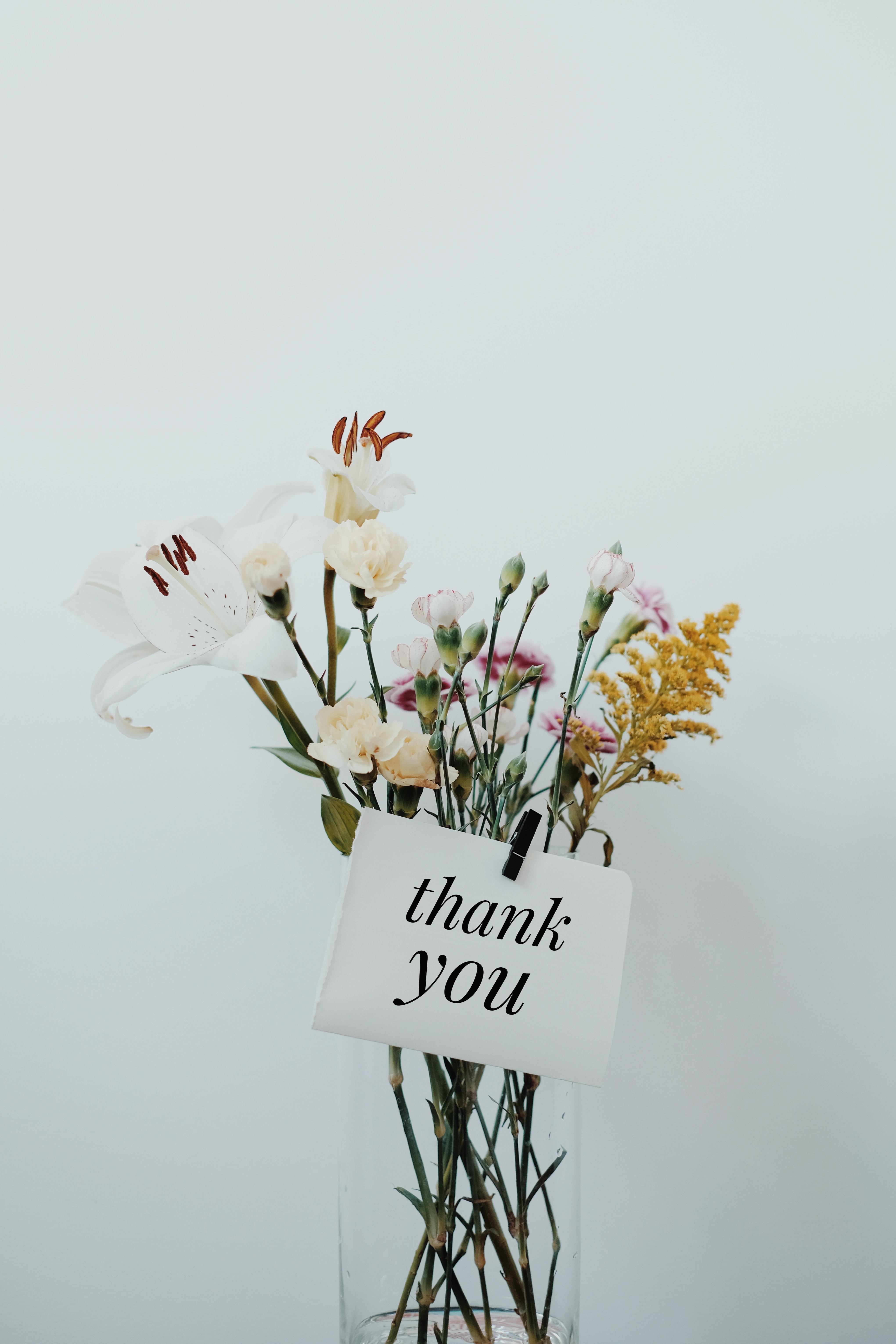 wildflowers in vase with thank you note