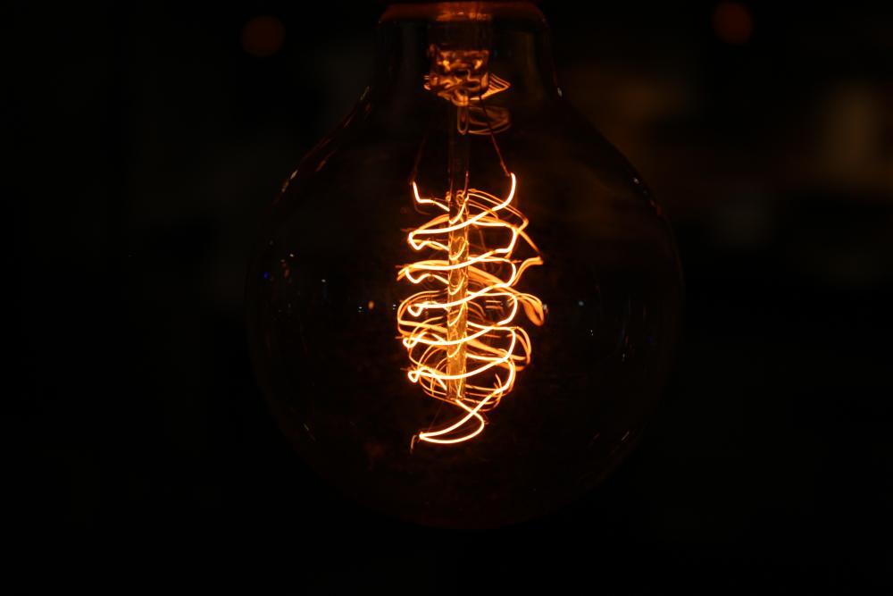a close up view of a lightbulb with a dark background