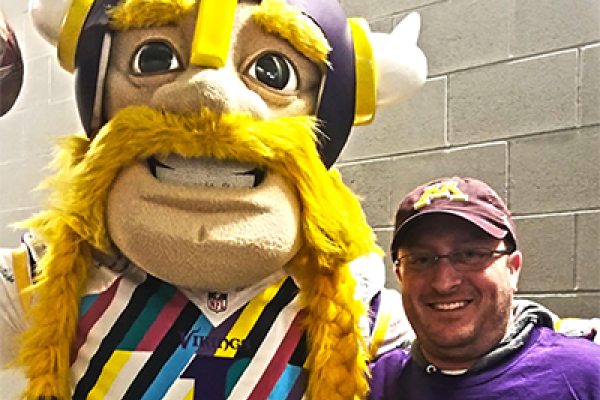 Viktor, the Vikings mascot, with Dr. Randy Singer