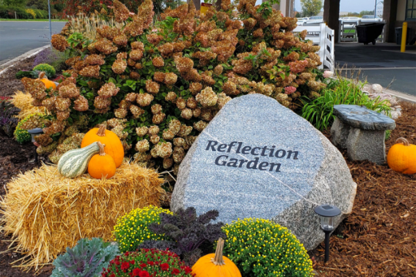 Equine reflection garden has stones and plants and decorations for remembering beloved horses