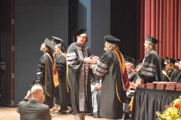 Em Adams receives degree