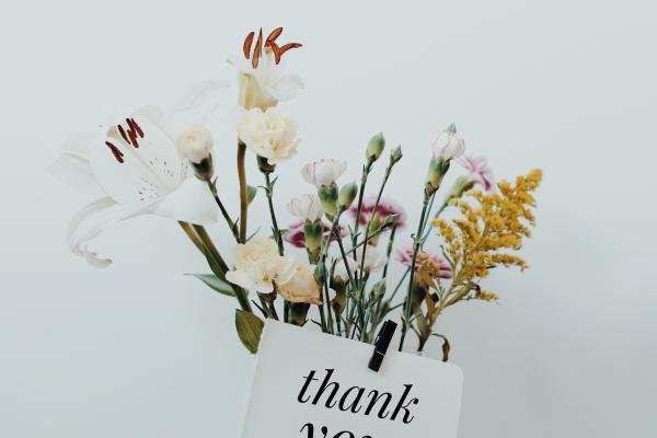wildflowers in vase with thank you note