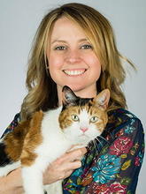Headshot of Dr. Erin Burton holding her pet cat